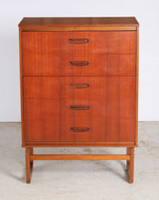 Load image into Gallery viewer, Mid Century teak chest of drawer with carved handles, circa 1960s.
