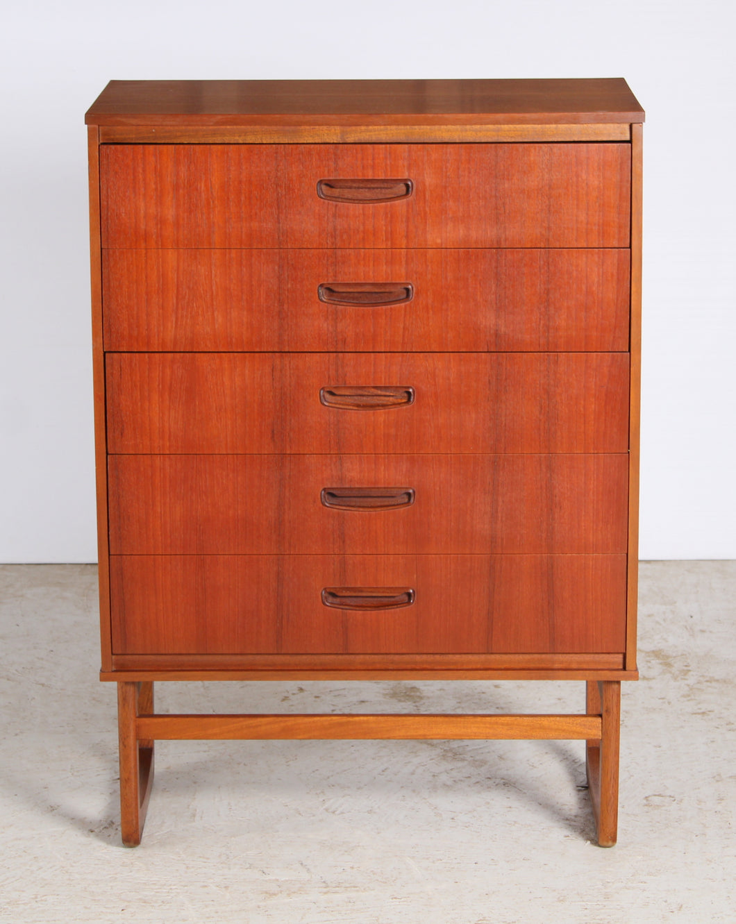 Mid Century teak chest of drawer with carved handles, circa 1960s.