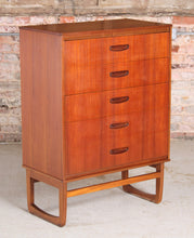Load image into Gallery viewer, Mid Century teak chest of drawer with carved handles, circa 1960s.

