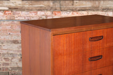 Load image into Gallery viewer, Mid Century teak chest of drawer with carved handles, circa 1960s.
