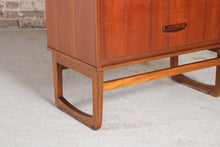 Load image into Gallery viewer, Mid Century teak chest of drawer with carved handles, circa 1960s.
