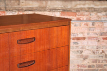 Load image into Gallery viewer, Mid Century teak chest of drawer with carved handles, circa 1960s.

