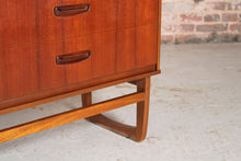 Load image into Gallery viewer, Mid Century teak chest of drawer with carved handles, circa 1960s.
