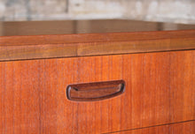 Load image into Gallery viewer, Mid Century teak chest of drawer with carved handles, circa 1960s.

