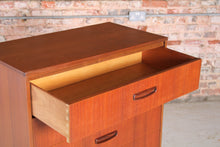 Load image into Gallery viewer, Mid Century teak chest of drawer with carved handles, circa 1960s.
