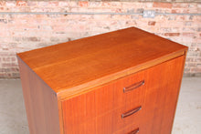 Load image into Gallery viewer, Mid Century teak chest of drawer with carved handles, circa 1960s.
