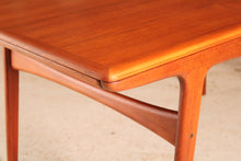Load image into Gallery viewer, Danish Mid Century extending teak dining table by Arne Hovmand Olsen for Mogens Kold, circa 1960s
