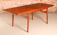 Load image into Gallery viewer, Danish Mid Century extending teak dining table by Arne Hovmand Olsen for Mogens Kold, circa 1960s

