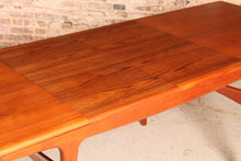Load image into Gallery viewer, Danish Mid Century extending teak dining table by Arne Hovmand Olsen for Mogens Kold, circa 1960s
