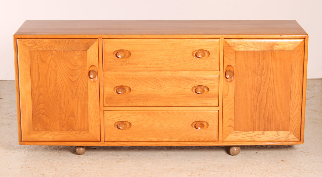 Mid Century Ercol Model 455 Elm Sideboard on Casters, circa 1970s.