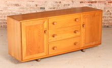 Load image into Gallery viewer, Mid Century Ercol Model 455 Elm Sideboard on Casters, circa 1970s.

