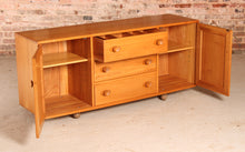Load image into Gallery viewer, Mid Century Ercol Model 455 Elm Sideboard on Casters, circa 1970s.
