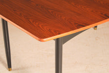 Load image into Gallery viewer, Mid Century extending rosewood dining table by Robin Day, circa 1960s.
