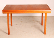 Load image into Gallery viewer, Mid Century extending teak dining table by White&amp;Newton, circa 1970s
