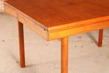 Load image into Gallery viewer, Mid Century extending teak dining table by White&amp;Newton, circa 1970s
