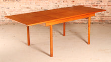 Load image into Gallery viewer, Mid Century extending teak dining table by White&amp;Newton, circa 1970s
