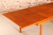 Load image into Gallery viewer, Mid Century extending teak dining table by White&amp;Newton, circa 1970s
