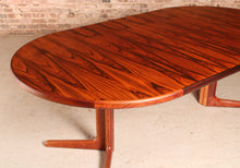 Load image into Gallery viewer, Danish Mid Century extending round/oval rosewood dining table, circa 1970s.

