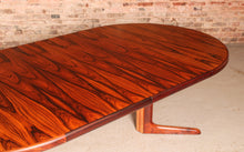 Load image into Gallery viewer, Danish Mid Century extending round/oval rosewood dining table, circa 1970s.
