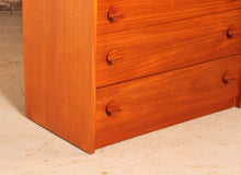 Load image into Gallery viewer, Mid Century teak chest of 4 drawers by Stag, circa 1970s.
