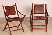 Load image into Gallery viewer, Contemporary campaign style teak, leather and brass folding chairs by Eichholtz
