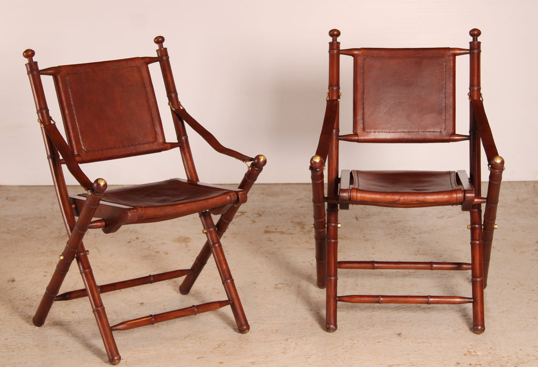 Contemporary campaign style teak, leather and brass folding chairs by Eichholtz