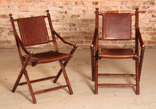 Load image into Gallery viewer, Contemporary campaign style teak, leather and brass folding chairs by Eichholtz
