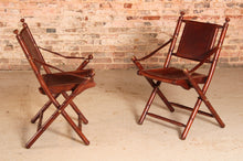 Load image into Gallery viewer, Contemporary campaign style teak, leather and brass folding chairs by Eichholtz
