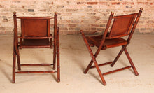 Load image into Gallery viewer, Contemporary campaign style teak, leather and brass folding chairs by Eichholtz
