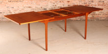 Load image into Gallery viewer, Mid Century extending teak dining table by Mcintosh, circa 1960s.

