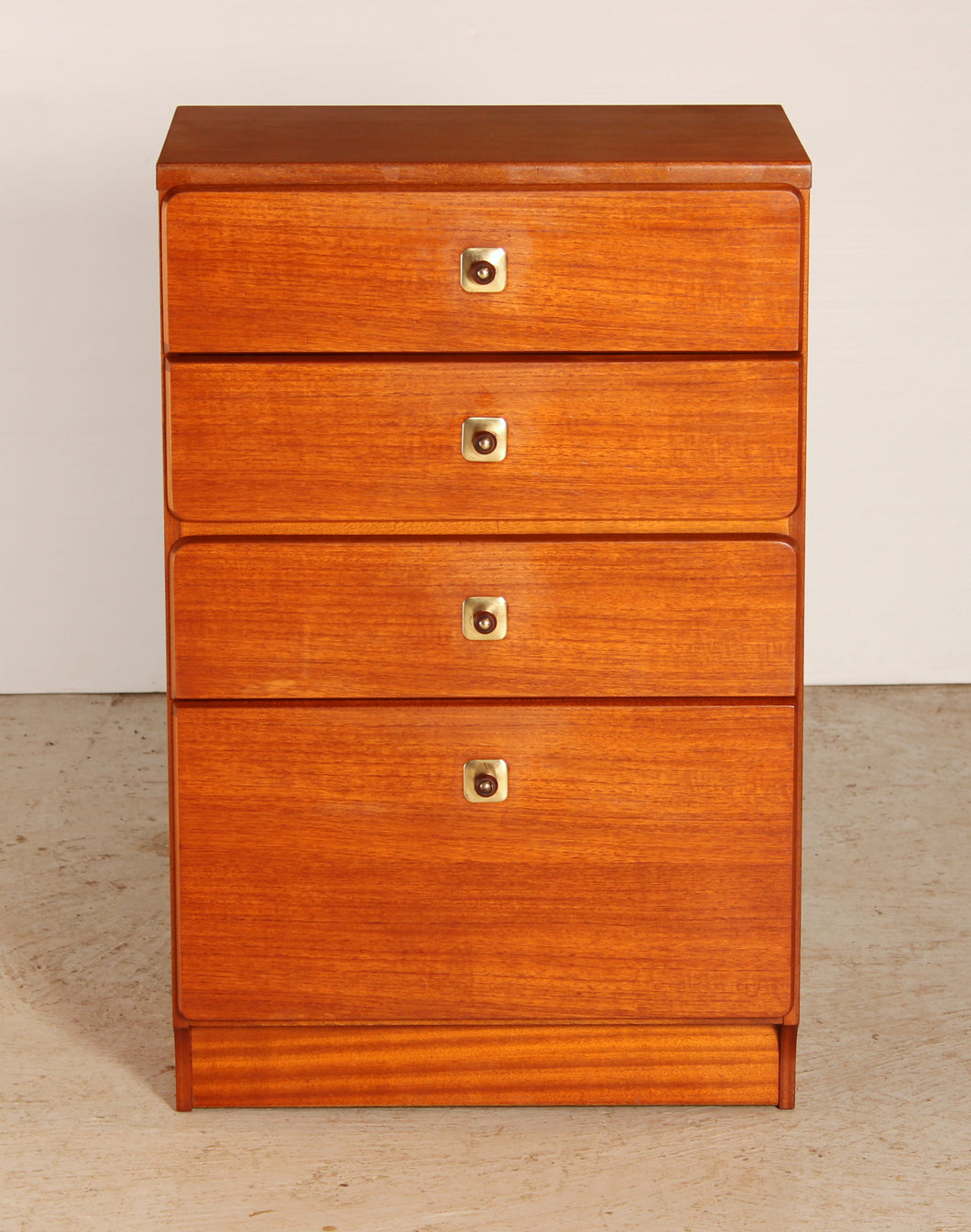 Mid Century teak chest of 4 drawers with teak and brass handles by McIntosh, circa 1970s.