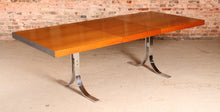Load image into Gallery viewer, Danish Mid Century extending teak dining table with chrome legs by Poul Norrelikt for Dyrlund, circa 1970s
