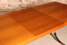 Load image into Gallery viewer, Danish Mid Century extending teak dining table with chrome legs by Poul Norrelikt for Dyrlund, circa 1970s
