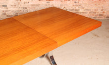 Load image into Gallery viewer, Danish Mid Century extending teak dining table with chrome legs by Poul Norrelikt for Dyrlund, circa 1970s
