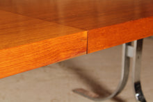 Load image into Gallery viewer, Danish Mid Century extending teak dining table with chrome legs by Poul Norrelikt for Dyrlund, circa 1970s
