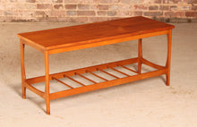 Load image into Gallery viewer, Mid Century teak coffee table with a magazine rack, circa 1960s
