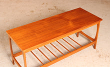 Load image into Gallery viewer, Mid Century teak coffee table with a magazine rack, circa 1960s
