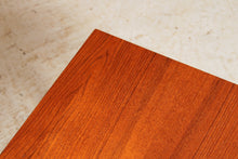 Load image into Gallery viewer, Mid Century teak coffee table with a magazine rack, circa 1960s

