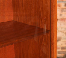 Load image into Gallery viewer, Mid Century glass fronted teak bookcase by Meredew, circa 1970s
