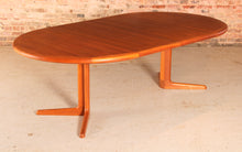 Load image into Gallery viewer, Danish Mid Century teak extending round dining table by Edvard Valentinsen, circa 1960s.
