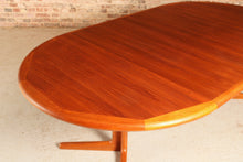 Load image into Gallery viewer, Danish Mid Century teak extending round dining table by Edvard Valentinsen, circa 1960s.
