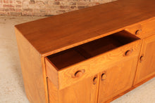 Load image into Gallery viewer, Mid Century Ercol Windsor solid elm sideboard on casters, circa 1960s
