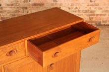 Load image into Gallery viewer, Mid Century Ercol Windsor solid elm sideboard on casters, circa 1960s
