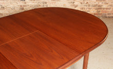 Load image into Gallery viewer, A mid century G Plan Fresco extending oval teak dining table, circa 1960s

