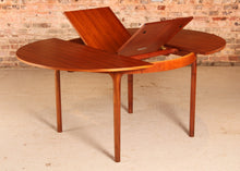 Load image into Gallery viewer, Mid Century round extending teak dining table by McIntosh, circa 1960s
