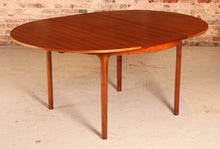 Load image into Gallery viewer, Mid Century round extending teak dining table by McIntosh, circa 1960s
