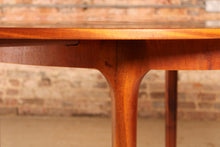 Load image into Gallery viewer, Mid Century round extending teak dining table by McIntosh, circa 1960s
