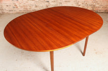 Load image into Gallery viewer, Mid Century round extending teak dining table by McIntosh, circa 1960s
