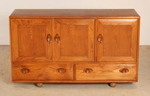 Load image into Gallery viewer, A mid century Ercol Windsor elm sideboard on casters, circa 1960s
