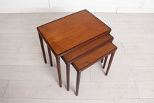 Load image into Gallery viewer, A Danish midcentury nest of three side tables made in teak and rosewood by E W Bach. Excellent restored condition.
